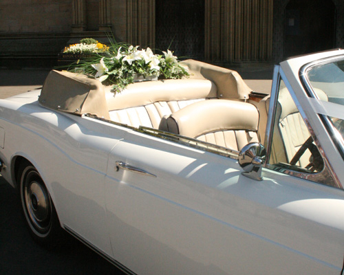Wedding cars come with chauffeur, ribbons and silk flowers